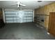 Functional garage offers storage and parking with some shelving at 7632 Lake Forest Cir, Port Richey, FL 34668