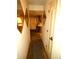 Hallway with unique mirrors and a view into the kitchen and dining area at 7632 Lake Forest Cir, Port Richey, FL 34668