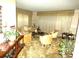 Bright living room featuring comfortable seating, a coffee table, and large windows at 7632 Lake Forest Cir, Port Richey, FL 34668