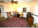 Inviting sitting room showcasing classic furniture and a patterned area rug at 7632 Lake Forest Cir, Port Richey, FL 34668