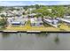 Waterfront homes featuring private docks on a sunny day at 800 Chesapeake Dr # 42, Tarpon Springs, FL 34689