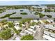 Aerial view of the community surrounded by lush greenery and waterfront views at 800 Chesapeake Dr # 42, Tarpon Springs, FL 34689