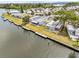 Waterfront homes featuring private docks on a sunny day at 800 Chesapeake Dr # 42, Tarpon Springs, FL 34689