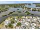 Aerial view of the waterfront community surrounded by the bay at 800 Chesapeake Dr # 42, Tarpon Springs, FL 34689