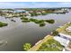 Picturesque waterfront view showing lush green islands and beautiful homes at 800 Chesapeake Dr # 42, Tarpon Springs, FL 34689