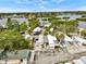 Aerial view of a community with mobile homes surrounded by trees and waterfront views at 800 Chesapeake Dr # 42, Tarpon Springs, FL 34689