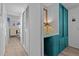 A peek inside shows a bedroom with blue storage and a white shuttered closet door at 800 Chesapeake Dr # 42, Tarpon Springs, FL 34689