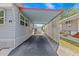 Gray home with convenient carport offering covered parking and protection from the elements at 800 Chesapeake Dr # 42, Tarpon Springs, FL 34689