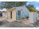 Exterior view of community building with nautical mural and ample parking at 800 Chesapeake Dr # 42, Tarpon Springs, FL 34689