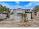 Exterior view of the home with storage shed, awning, and guest parking sign at 800 Chesapeake Dr # 42, Tarpon Springs, FL 34689