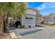 Charming gray home with a well-kept yard, complete with a grill and covered parking at 800 Chesapeake Dr # 42, Tarpon Springs, FL 34689