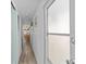 Hallway view with a table and chairs beyond at 800 Chesapeake Dr # 42, Tarpon Springs, FL 34689