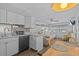 The kitchen looks out to the dining table and the living area, great for entertaining at 800 Chesapeake Dr # 42, Tarpon Springs, FL 34689
