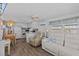 Bright and cozy living area featuring an open concept layout with a TV and comfortable seating at 800 Chesapeake Dr # 42, Tarpon Springs, FL 34689
