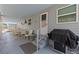 Charming covered patio with lattice, outdoor seating, and a grill, perfect for relaxing and entertaining at 800 Chesapeake Dr # 42, Tarpon Springs, FL 34689