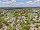 Aerial view of community with golf course, pool, and clubhouse at 8001 Summerbreeze Ter, Spring Hill, FL 34606