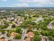 Beautiful aerial view of home in a community next to a golf course and pond at 8001 Summerbreeze Ter, Spring Hill, FL 34606