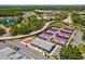 Aerial view of community pickleball courts, a basketball court, covered area, and parking lots at 8001 Summerbreeze Ter, Spring Hill, FL 34606