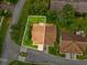 Aerial view of the property showcasing its roof, yard, driveway, and nearby streets at 8001 Summerbreeze Ter, Spring Hill, FL 34606