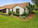 Beautiful backyard featuring a well-maintained lawn and landscaping beds at 8001 Summerbreeze Ter, Spring Hill, FL 34606