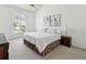 Serene bedroom with a large window, neutral tones, and comfortable bedding at 8001 Summerbreeze Ter, Spring Hill, FL 34606