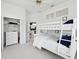 Bedroom featuring a white bunk bed, closet and dresser with an open door leading to the kitchen at 8001 Summerbreeze Ter, Spring Hill, FL 34606