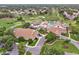 Aerial view of the community center with a pool, golf course, and lush landscaping creating an inviting recreational space at 8001 Summerbreeze Ter, Spring Hill, FL 34606