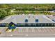 Well-maintained commercial building with ample parking and manicured landscaping at 8001 Summerbreeze Ter, Spring Hill, FL 34606