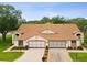 Beautiful home featuring a brick driveway, neutral paint, and a two-car garage at 8001 Summerbreeze Ter, Spring Hill, FL 34606