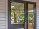 Exterior doors with Arts & Crafts Conference Room sign, highlighting the community's amenities at 8001 Summerbreeze Ter, Spring Hill, FL 34606