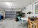Spacious two car garage with a golf cart, workbench, tools and plenty of extra storage at 8001 Summerbreeze Ter, Spring Hill, FL 34606