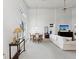 Spacious living room with high ceilings, ample natural light, neutral tones, and an adjacent dining area at 8001 Summerbreeze Ter, Spring Hill, FL 34606