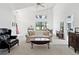 Bright living room with vaulted ceilings, large windows, and comfortable furnishings at 8001 Summerbreeze Ter, Spring Hill, FL 34606