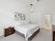 Clean, spacious bedroom with high ceilings, neutral colors, soft carpet, and serene ambiance at 8001 Summerbreeze Ter, Spring Hill, FL 34606