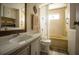 Full bathroom with shower/tub combo, vanity, and vinyl flooring at 803 Frances Dr, Tarpon Springs, FL 34689
