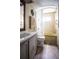 Full bathroom with shower/tub combo, vanity, and vinyl flooring at 803 Frances Dr, Tarpon Springs, FL 34689