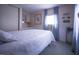 Bright bedroom with carpeted floors and blue curtains providing a comfortable space at 803 Frances Dr, Tarpon Springs, FL 34689