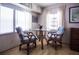 Bright dining area features two windows and seating for two at 803 Frances Dr, Tarpon Springs, FL 34689
