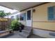 View of the front of this single story home, showing the steps and front door at 803 Frances Dr, Tarpon Springs, FL 34689
