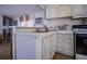 Kitchen features ample cabinet space, and wood laminate flooring at 803 Frances Dr, Tarpon Springs, FL 34689