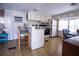 Bright eat-in kitchen features modern appliances, ample cabinet space, and wood laminate flooring at 803 Frances Dr, Tarpon Springs, FL 34689