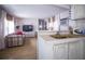 Open-concept living area offers seamless flow between kitchen and seating area at 803 Frances Dr, Tarpon Springs, FL 34689