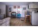 Open-concept living area offers seamless flow between kitchen and seating area at 803 Frances Dr, Tarpon Springs, FL 34689
