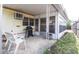 Covered patio with furniture and a grill with a view of the yard at 803 Frances Dr, Tarpon Springs, FL 34689