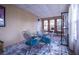 Sunroom with tiled floors, lots of natural light, and seating area with a glass table at 803 Frances Dr, Tarpon Springs, FL 34689