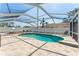 The home has a pool and a screened enclosure at 8749 Aruba Ln, Port Richey, FL 34668