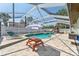 The pool and deck area offer an outdoor space to relax at 8749 Aruba Ln, Port Richey, FL 34668