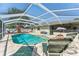 Enjoy this pool and deck area at 8749 Aruba Ln, Port Richey, FL 34668