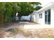 Backyard featuring patio, some trees, and room for entertaining at 9200 Lunar Ln, Port Richey, FL 34668