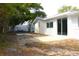 Backyard featuring patio, some trees, and room for entertaining at 9200 Lunar Ln, Port Richey, FL 34668